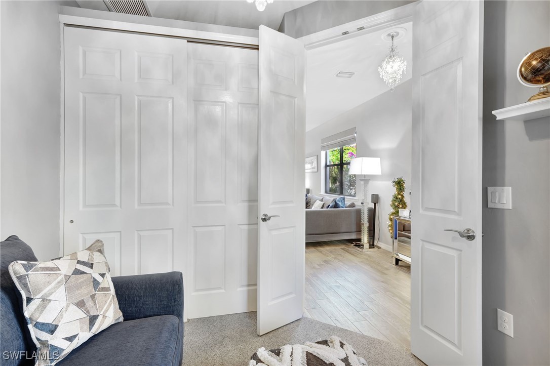 10908 Clarendon Street Fort Myers, FL 33913 - Photo 27 of 49 a living room with furniture and a wooden floor