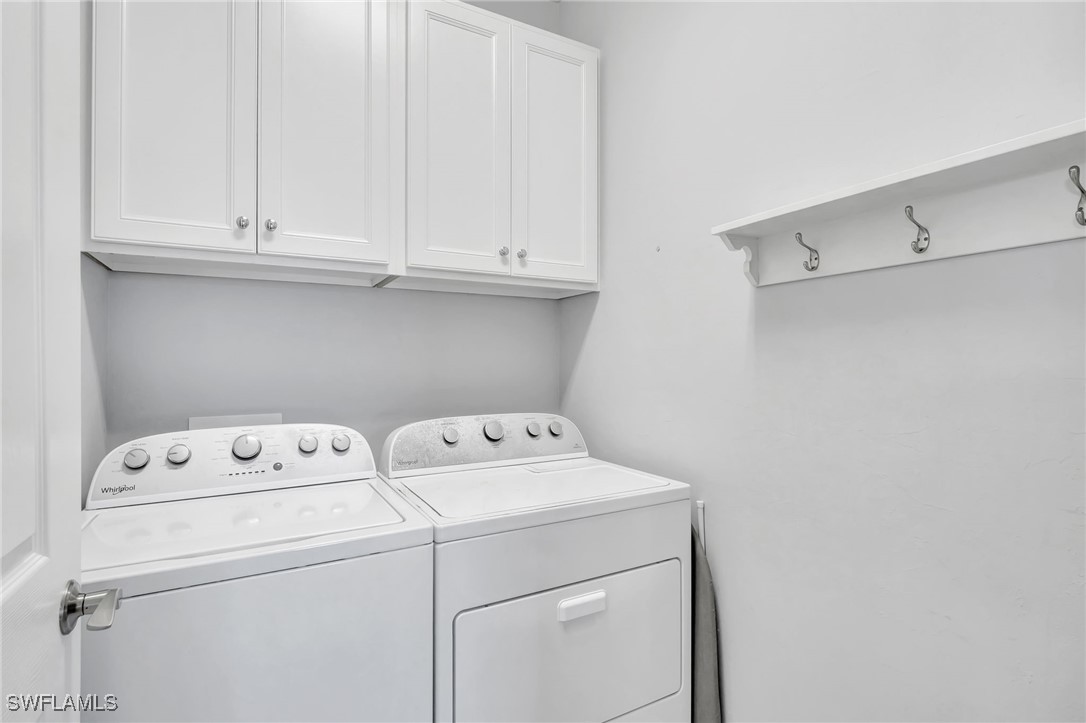10908 Clarendon Street Fort Myers, FL 33913 - Photo 28 of 49 a utility room with dryer and washer