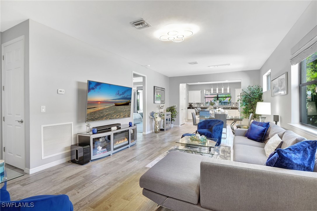 10908 Clarendon Street Fort Myers, FL 33913 - Photo 4 of 49 a living room with furniture and a flat screen tv