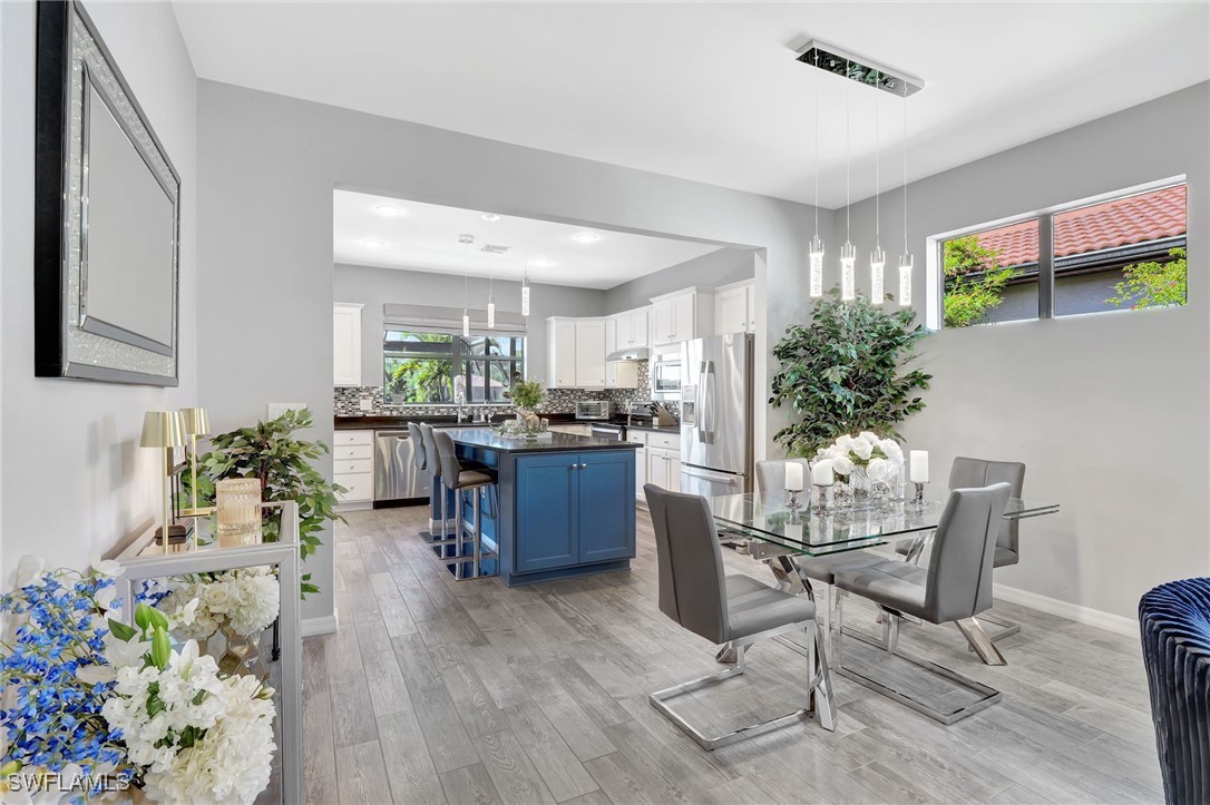 10908 Clarendon Street Fort Myers, FL 33913 - Photo 8 of 49 a living room with furniture potted plant and kitchen view