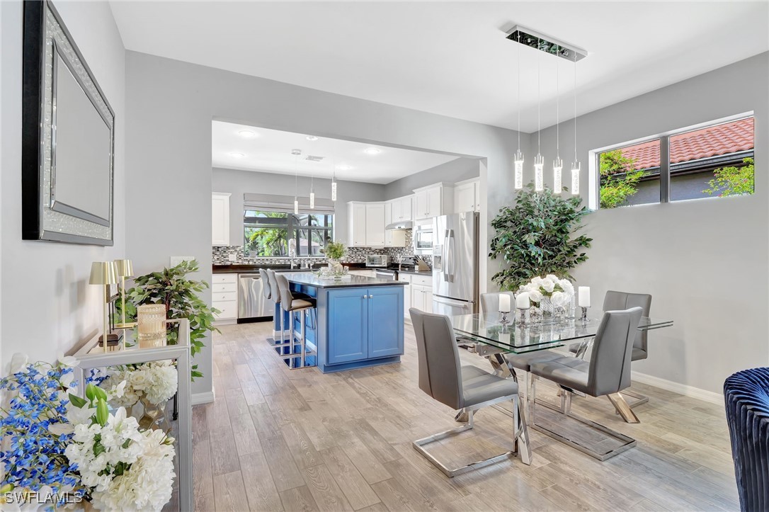 10908 Clarendon Street Fort Myers, FL 33913 - Photo 10 of 49 a living room with furniture potted plant and kitchen view