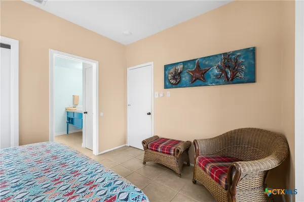 a bedroom with a bed and couch