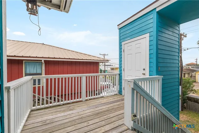 a view of a balcony with wooden floor