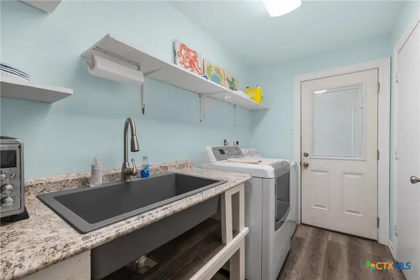 a kitchen with a stove and a sink