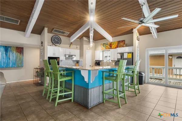 a view of an chairs and tables in the patio