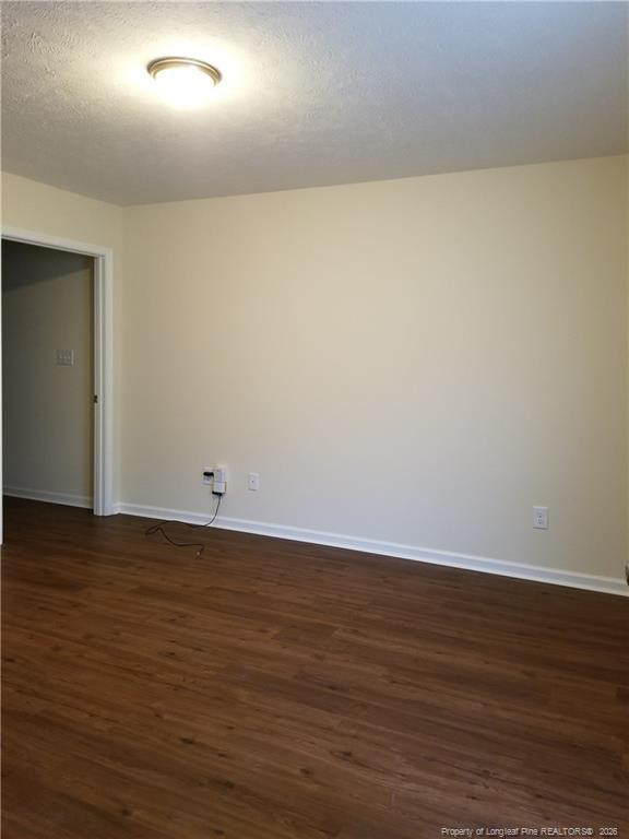 2402 7th Street Road, Unit B Lumberton, NC 28358 - Photo 8 of 10 a view of an empty room with wooden floor