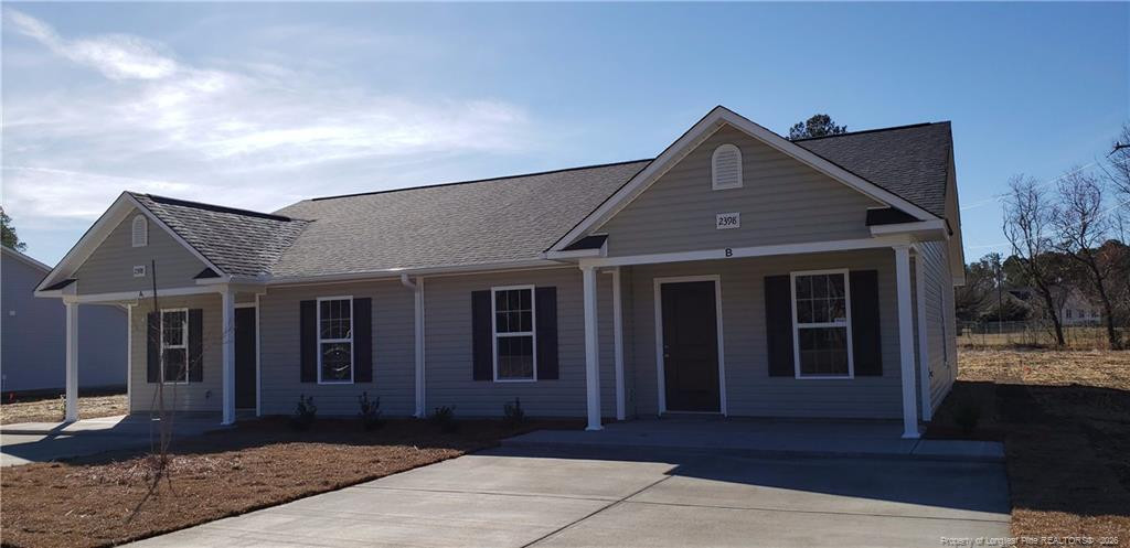 2402 7th Street Road, Unit B Lumberton, NC 28358 - Photo 10 of 10 a front view of a house with garden
