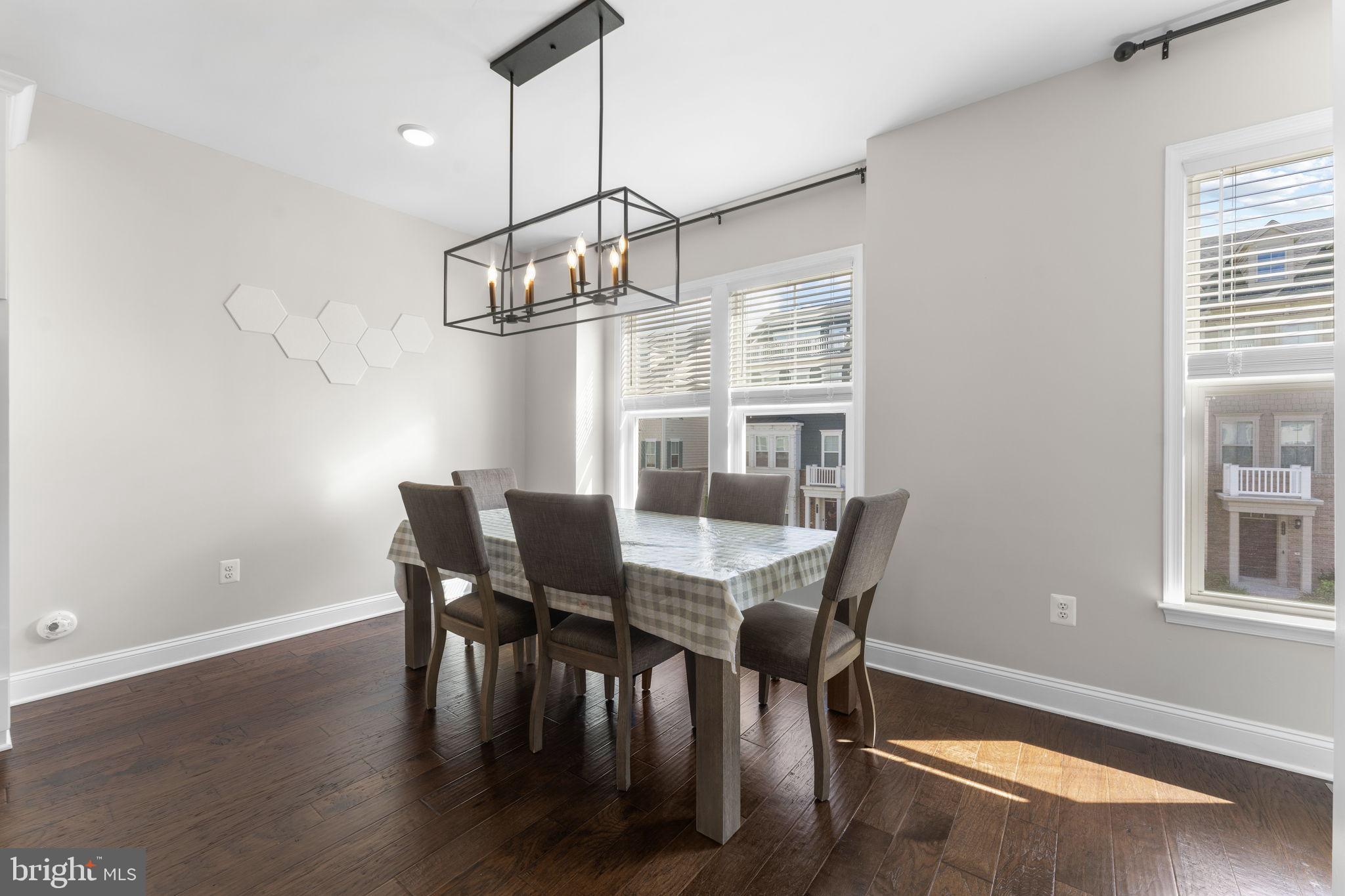 17372 Redshank Road Dumfries, VA 22026 - Photo 16 of 51 a view of a dining room with furniture window and wooden floor