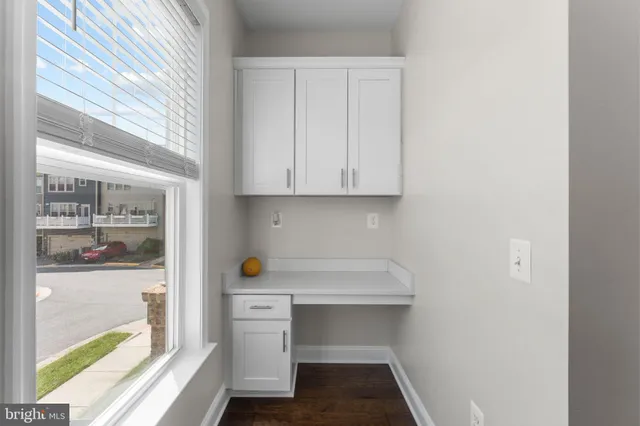 a view of cabinets and window