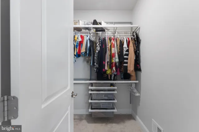 a bathroom with a granite countertop sink a mirror and vanity