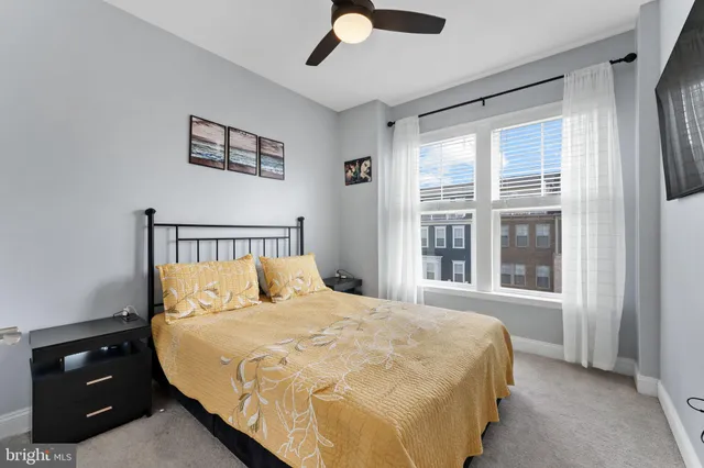 a bed room with a bed and a painting