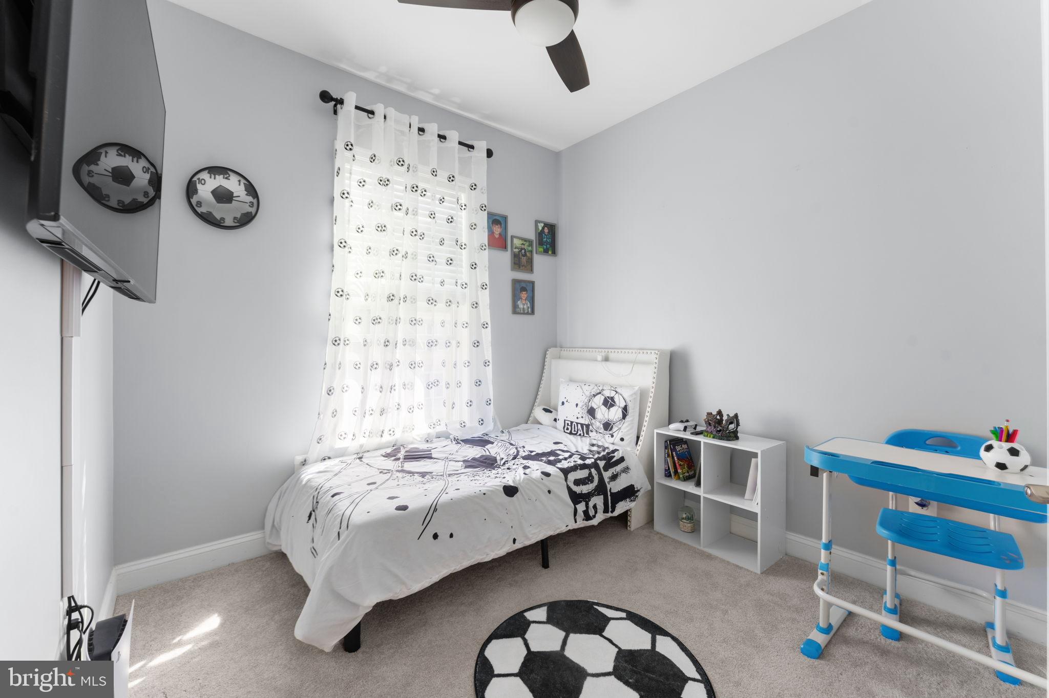 17372 Redshank Road Dumfries, VA 22026 - Photo 29 of 51 a bedroom with a bed and a chair in it