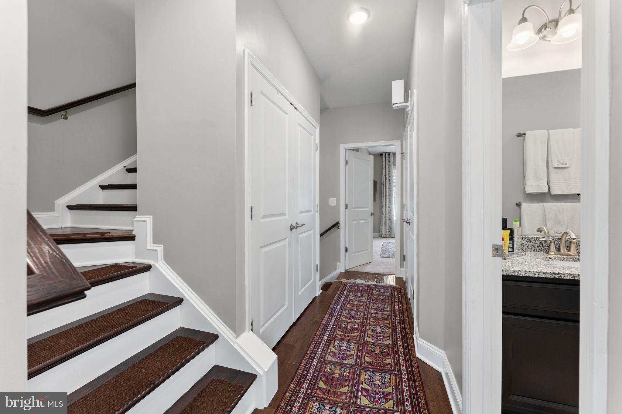 17372 Redshank Road Dumfries, VA 22026 - Photo 31 of 51 a view of a hallway with wooden floor and staircase