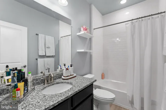 a kitchen with stainless steel appliances granite countertop a stove and a refrigerator