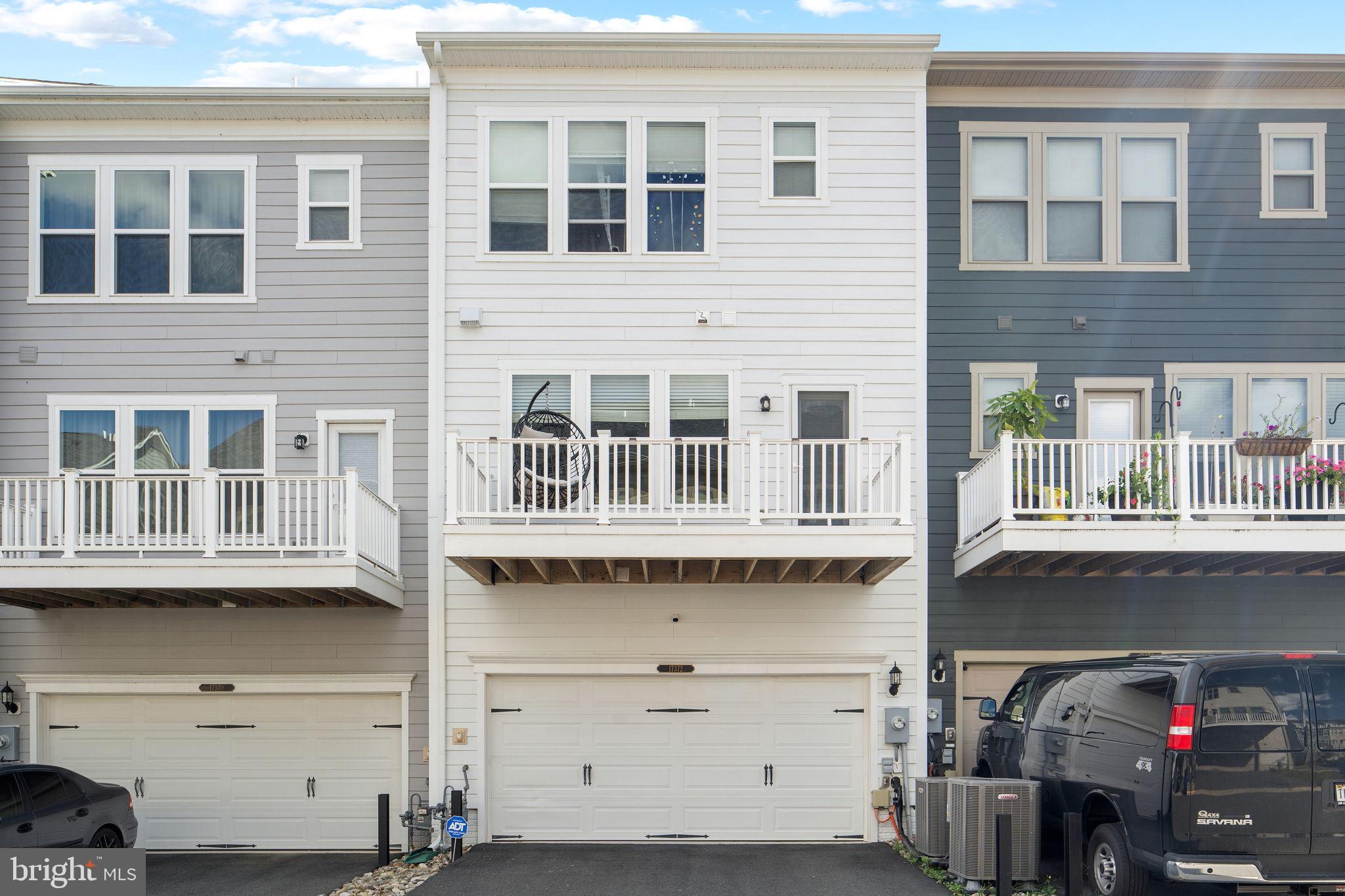 17372 Redshank Road Dumfries, VA 22026 - Photo 39 of 51 a front view of a building with many windows