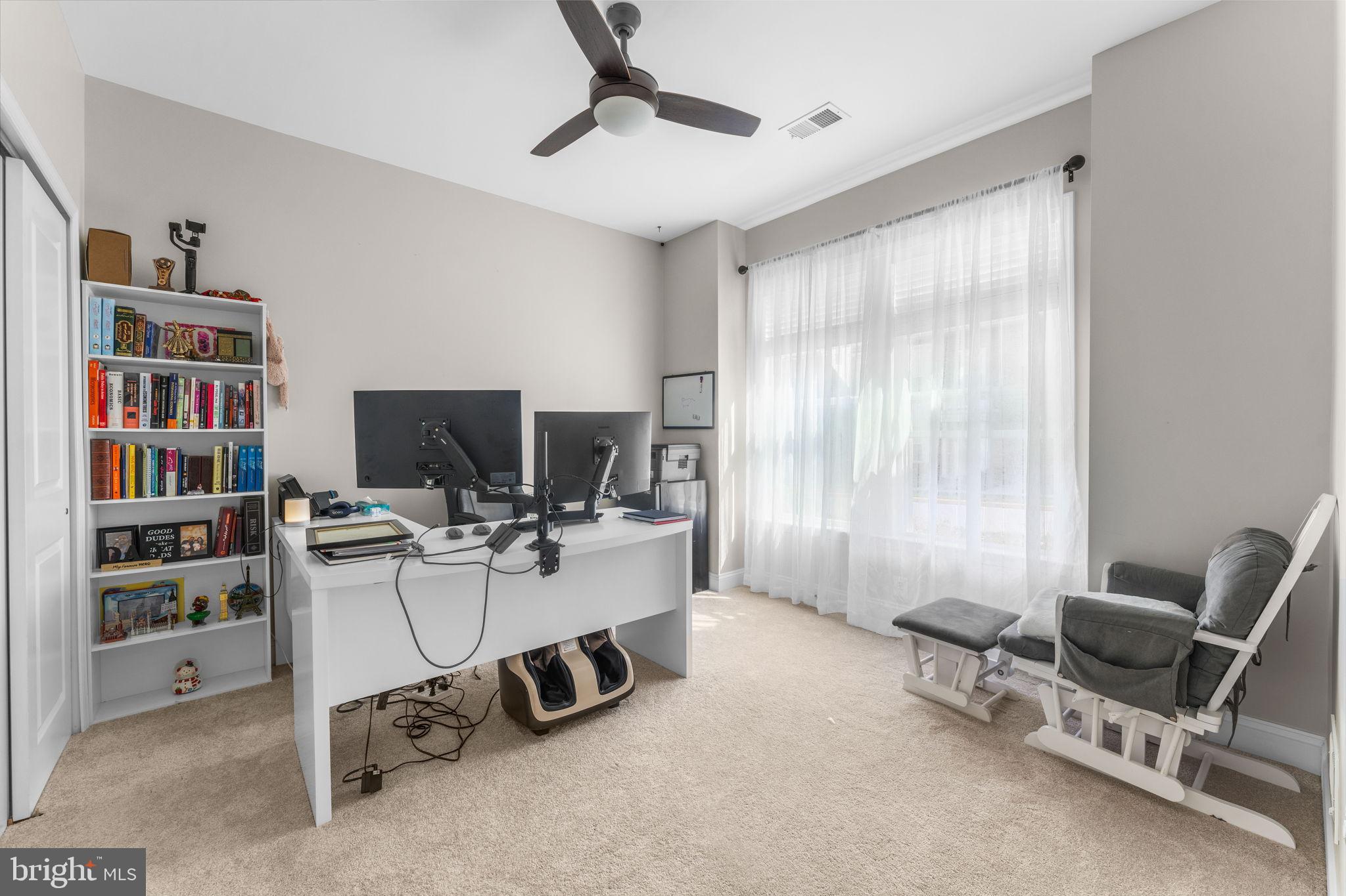 17372 Redshank Road Dumfries, VA 22026 - Photo 4 of 51 a view of a workspace with furniture and a window