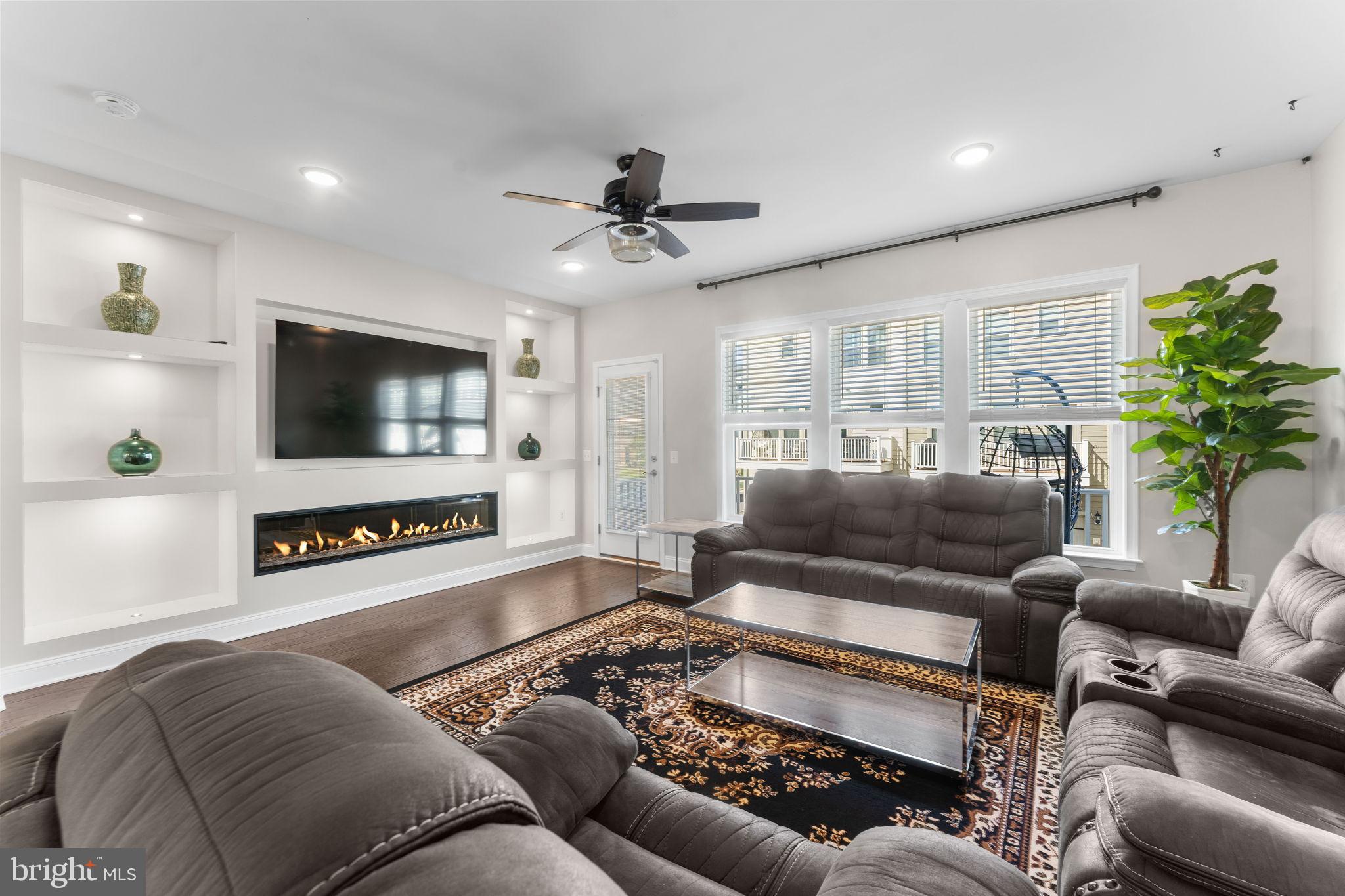 17372 Redshank Road Dumfries, VA 22026 - Photo 8 of 51 a living room with furniture and a flat screen tv