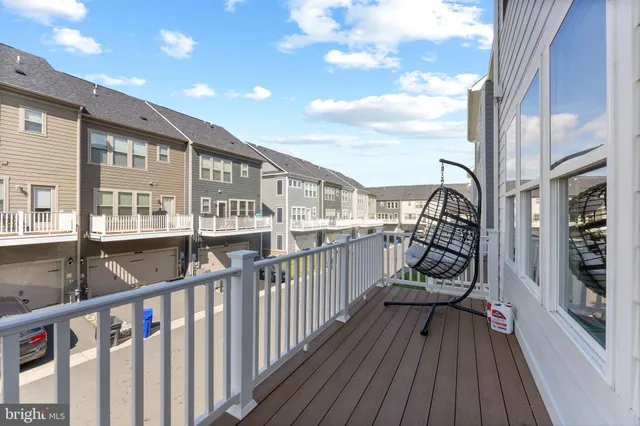 a view of a balcony with wooden floor