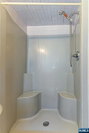 a bathroom with a toilet and shower
