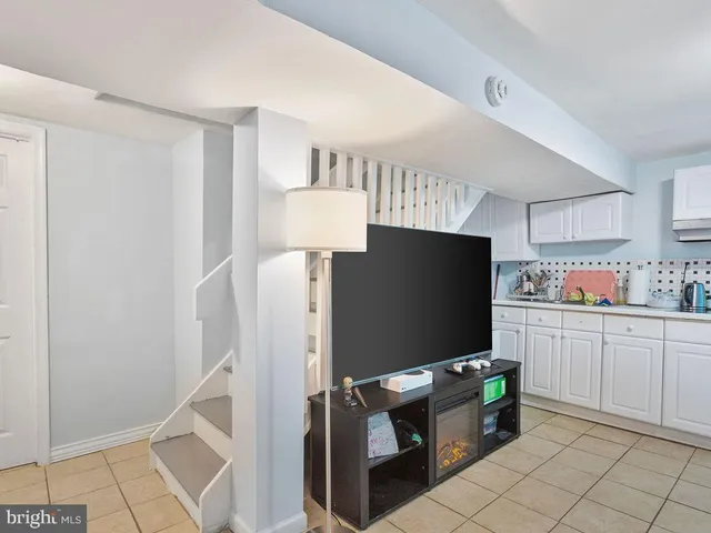 a room with cabinets and flat screen tv
