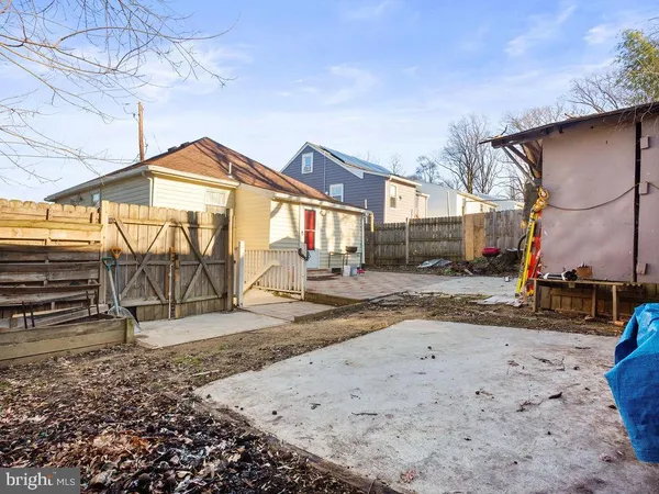 a view of a park with iron fence