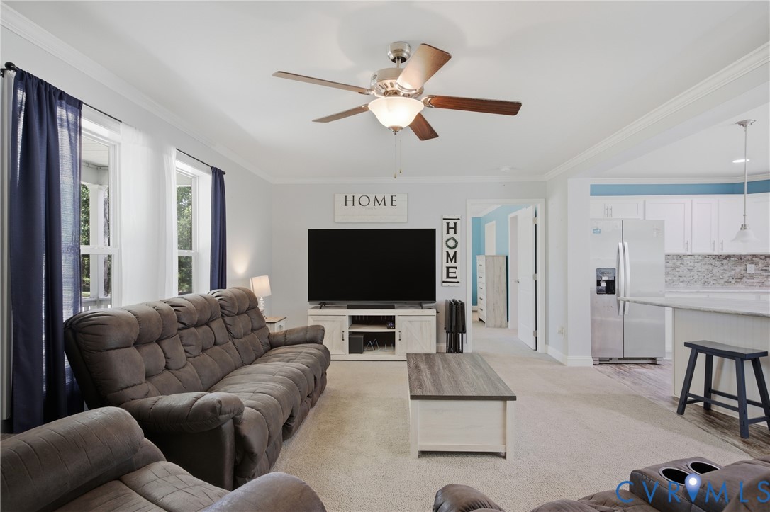 93 Faraway Road Saluda, VA 23149 - Photo 7 of 58 a living room with furniture and a flat screen tv