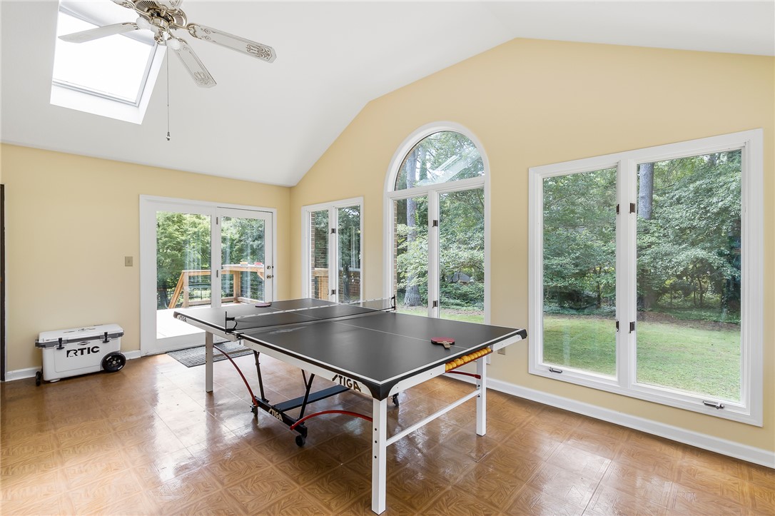 207 Laurel Ridge Road Anderson, SC 29621 - Photo 22 of 50 Sun-filled recreation space boasts vaulted ceilings and expansive windows overlooking the serene yard.