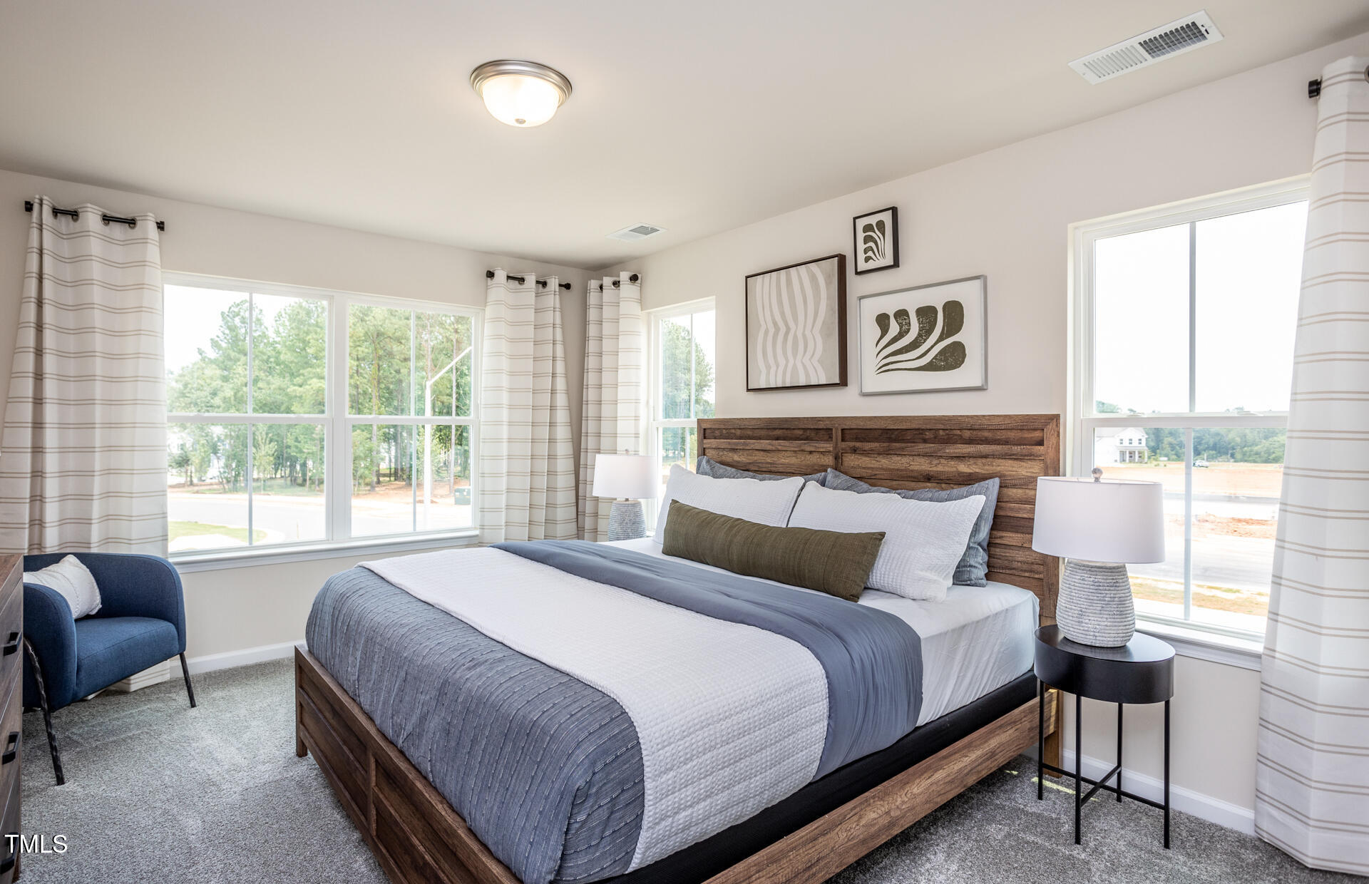 288 Fosterton Cottage Way Raleigh, NC 27603 - Photo 16 of 27 a bedroom with a bed and a large window