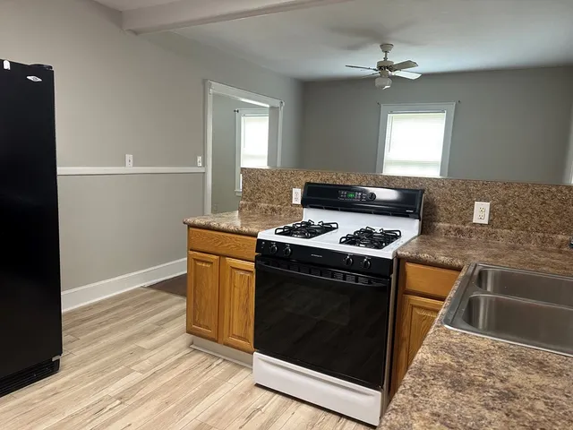 a kitchen with a stove and a microwave