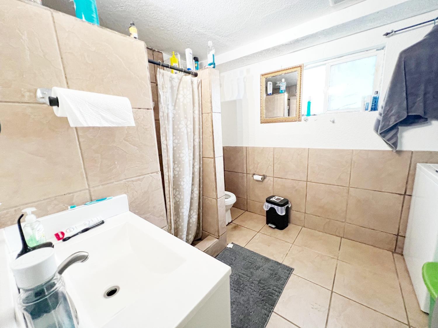 15731 Andrus Island Road Isleton, CA 95641 - Photo 16 of 40 a bathroom with a sink a toilet and a shower