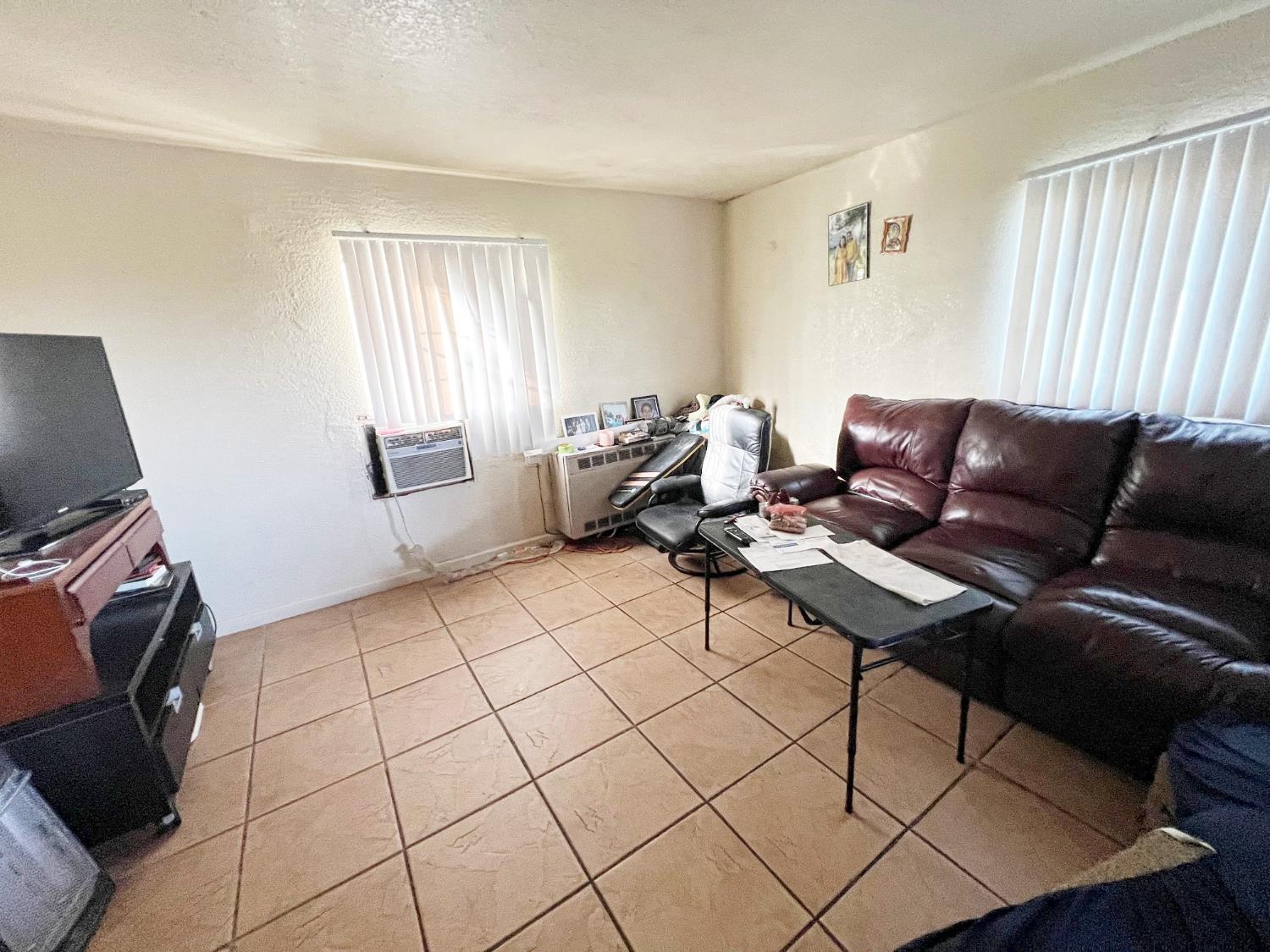 15731 Andrus Island Road Isleton, CA 95641 - Photo 20 of 40 a living room with furniture and a flat screen tv