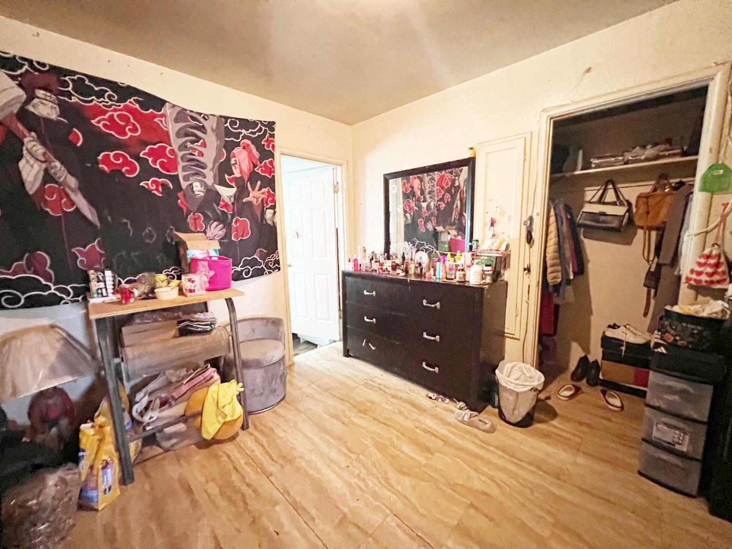 15731 Andrus Island Road Isleton, CA 95641 - Photo 24 of 40 a bedroom with a bed and wooden floor