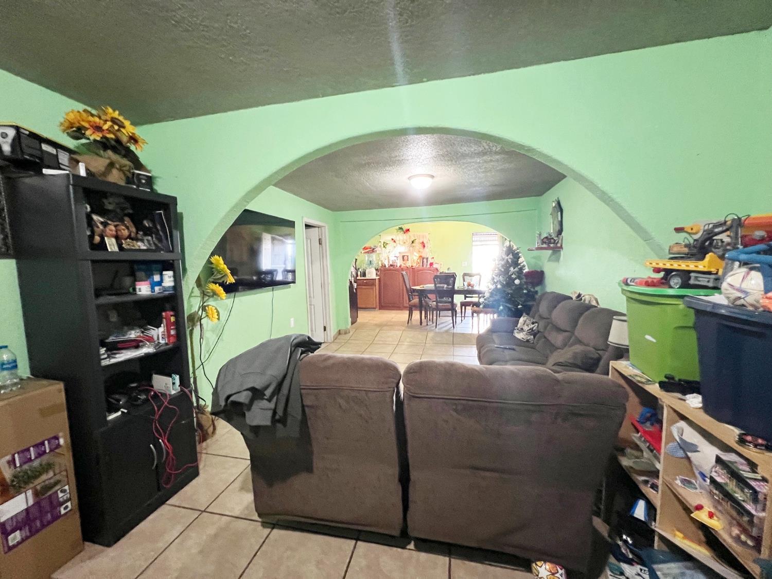 15731 Andrus Island Road Isleton, CA 95641 - Photo 9 of 40 a living room with furniture and a flat screen tv