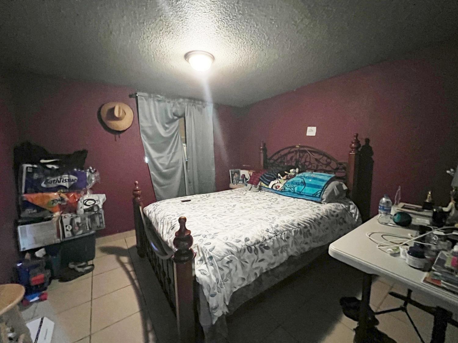 15731 Andrus Island Road Isleton, CA 95641 - Photo 10 of 40 a bed sitting in a bedroom next to a window