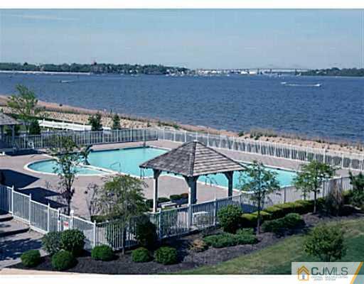 27 Raritan Reach Road South Amboy, NJ 08879 - Photo 1 of 24 a view of a house with a yard and lake view