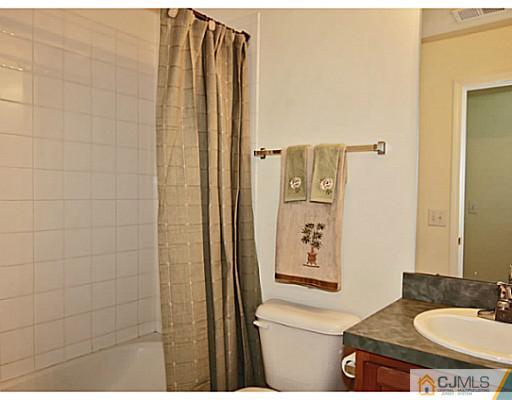 27 Raritan Reach Road South Amboy, NJ 08879 - Photo 18 of 24 a bathroom with a toilet sink and shower