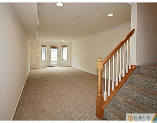 27 Raritan Reach Road South Amboy, NJ 08879 - Photo 20 of 24 a view of a hallway with a window and stairs