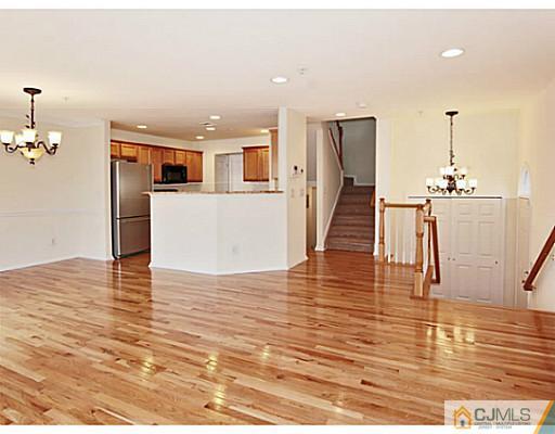 27 Raritan Reach Road South Amboy, NJ 08879 - Photo 5 of 24 a view of a room with wooden floor and stairs