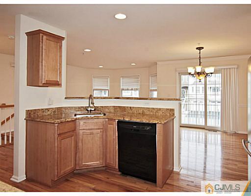 27 Raritan Reach Road South Amboy, NJ 08879 - Photo 7 of 24 a kitchen with stainless steel appliances granite countertop a stove a sink and a refrigerator
