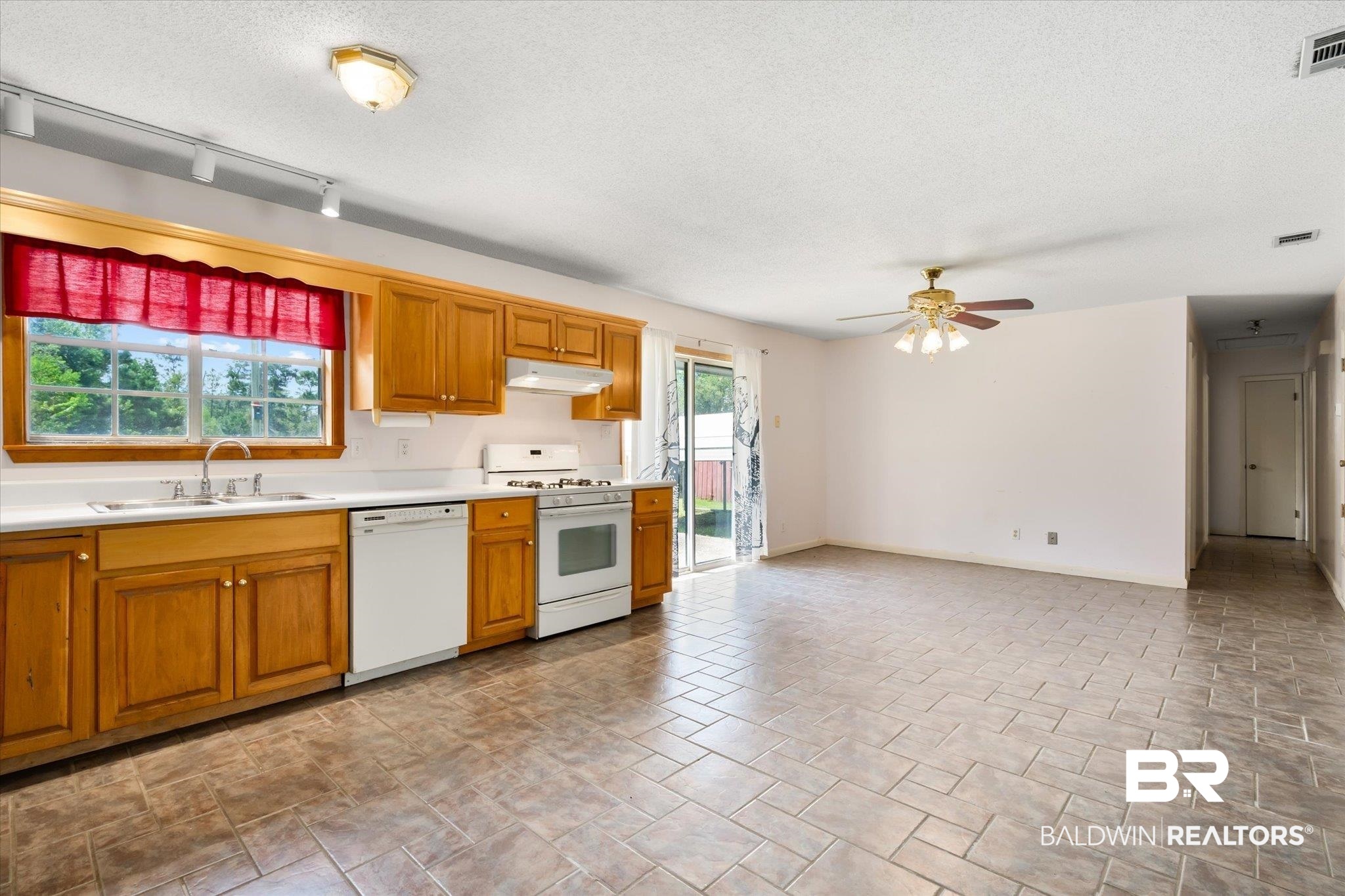 16808 Witt Road Bon Secour, AL 36511 - Photo 5 of 31 Kitchen featuring rail lighting, white appliances, a textured ceiling, ceiling fan, and sink