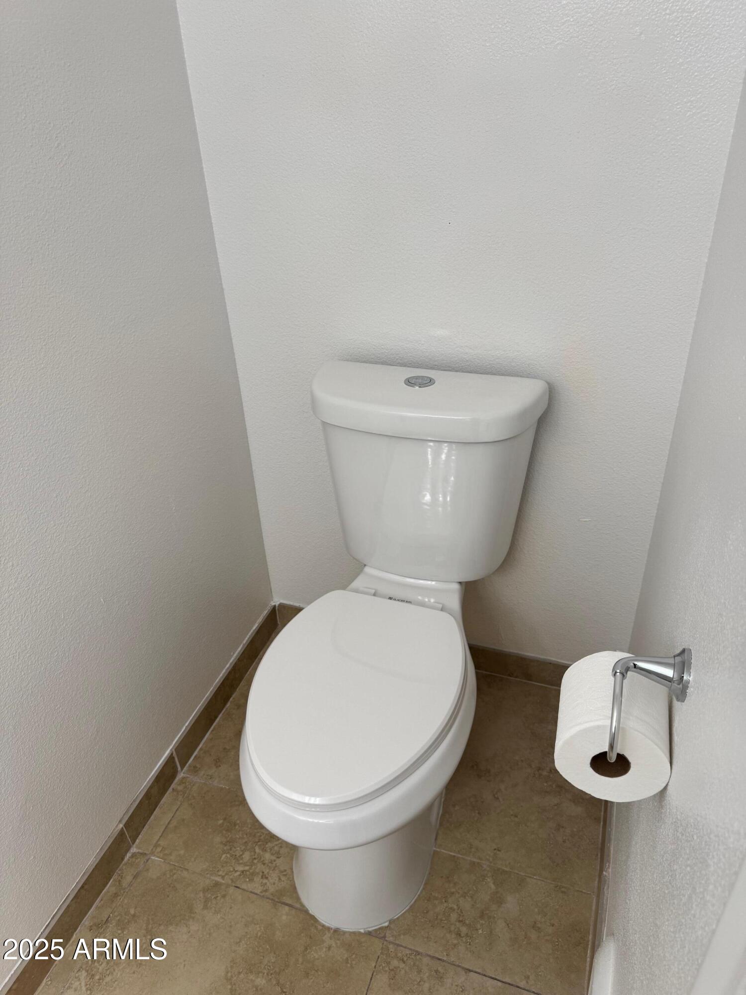 8861 North 12th Place Phoenix, AZ 85020 - Photo 16 of 25 a white toilet sitting next to a white sink