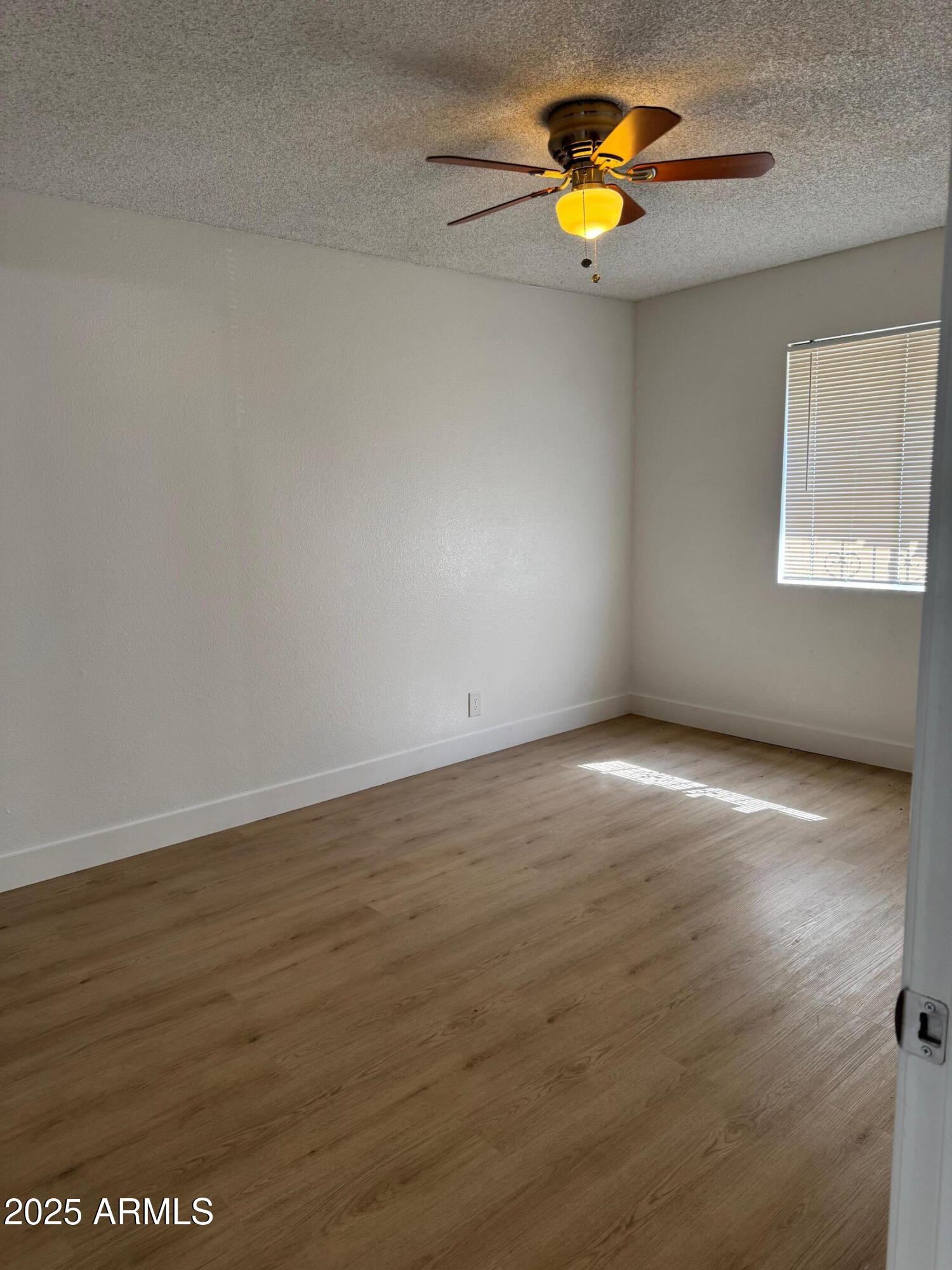 8861 North 12th Place Phoenix, AZ 85020 - Photo 17 of 25 a view of an empty room with window