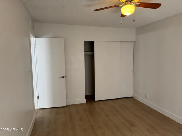 a view of a livingroom with wooden floor