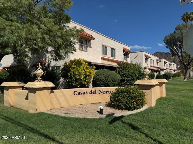 8861 North 12th Place Phoenix, AZ 85020 - Photo 24 of 25 a view of a white house with a yard and sitting area