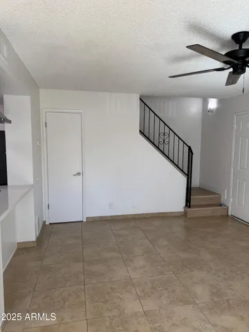 a view of an empty room with stairs