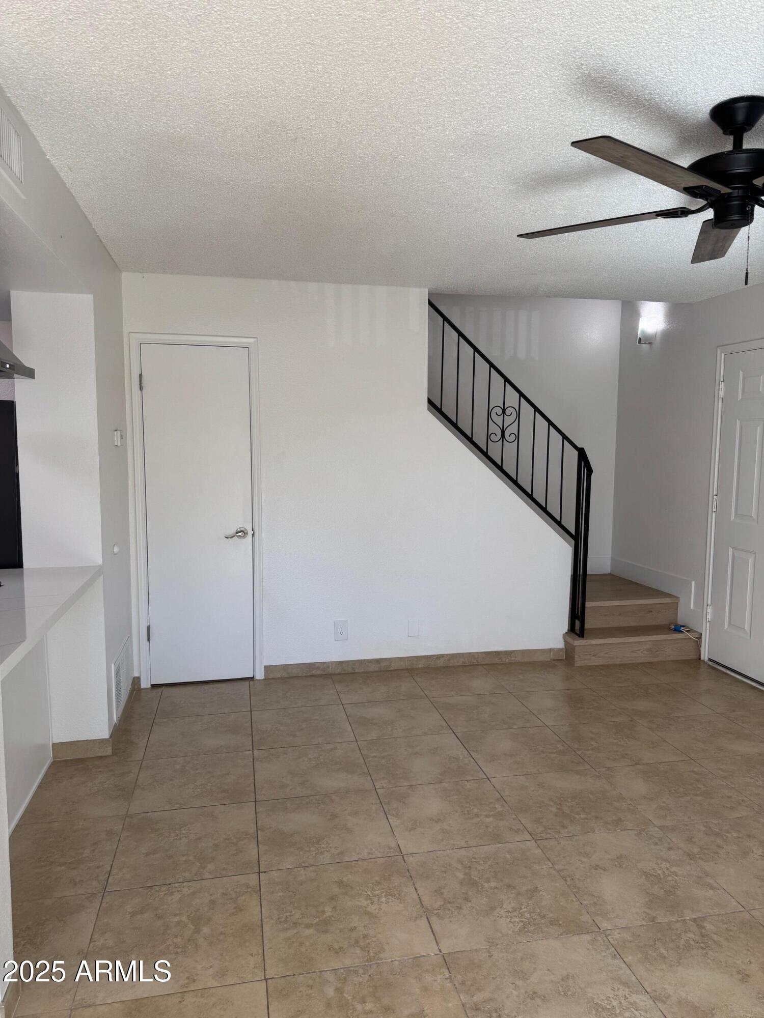 8861 North 12th Place Phoenix, AZ 85020 - Photo 10 of 25 a view of an empty room with stairs