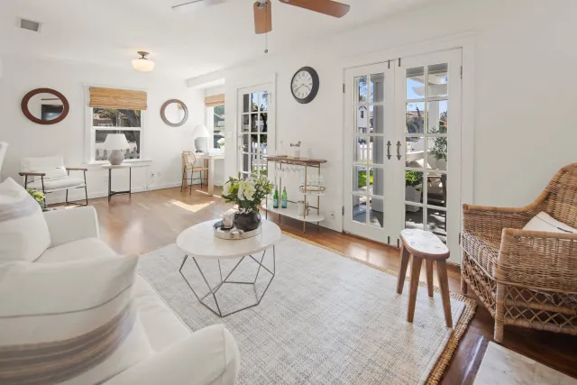 a view of a dining room with furniture wooden floor and chandelier