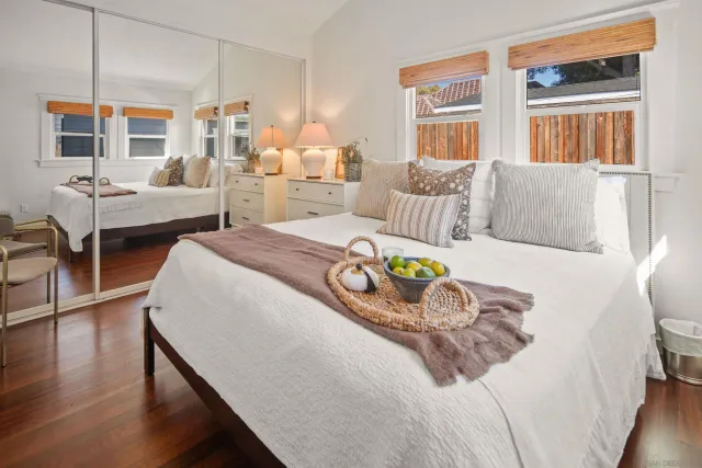 a bedroom with a bed and a dresser