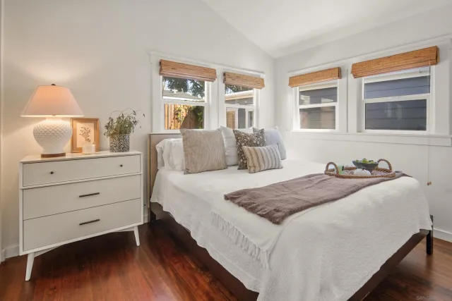 a bathroom with a sink a toilet and a window