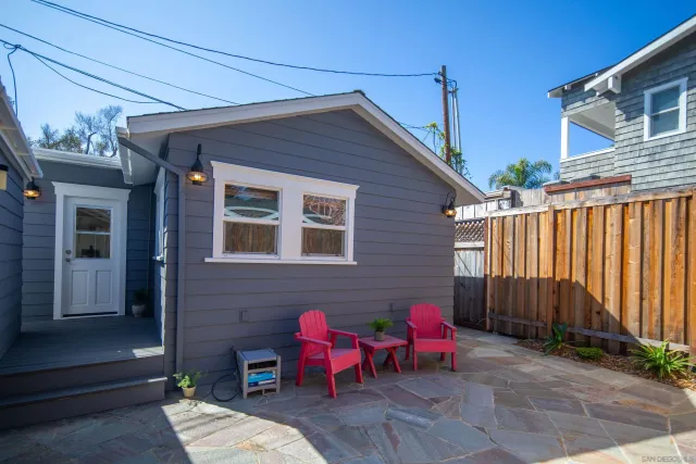 a bedroom with a bed and a white wall